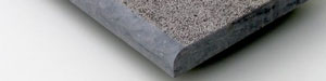 Bush-hammered stone pool coping and rounded edge